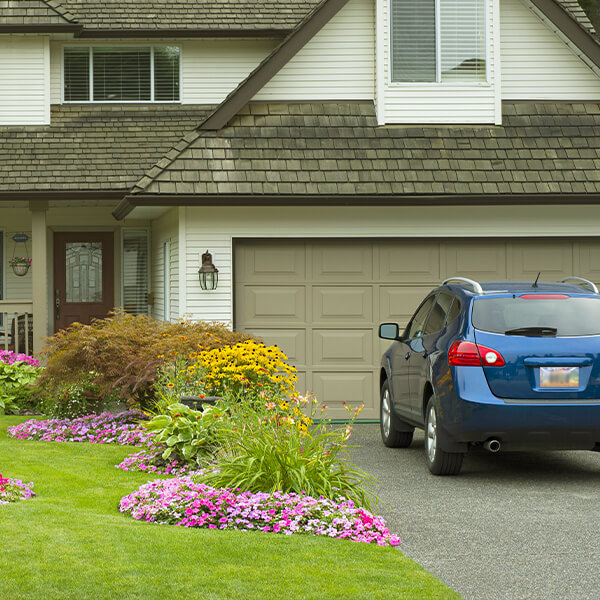 Car and House with flowers in yard