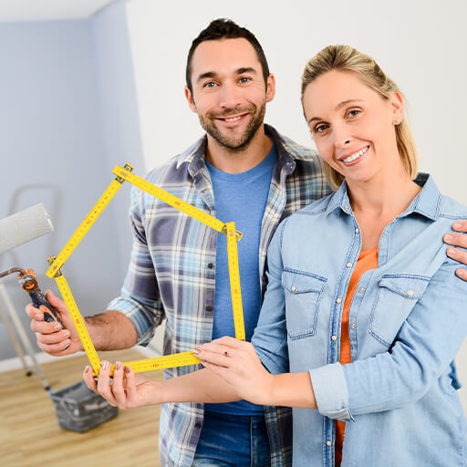 Happy couple renovating their home with a HELOC