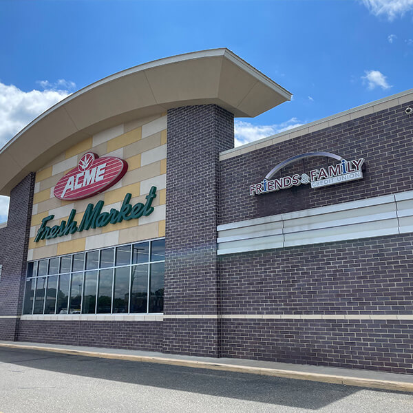 ACME market exterior with Friends and Family branch signage