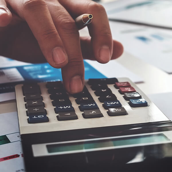 hand using a desk calculator