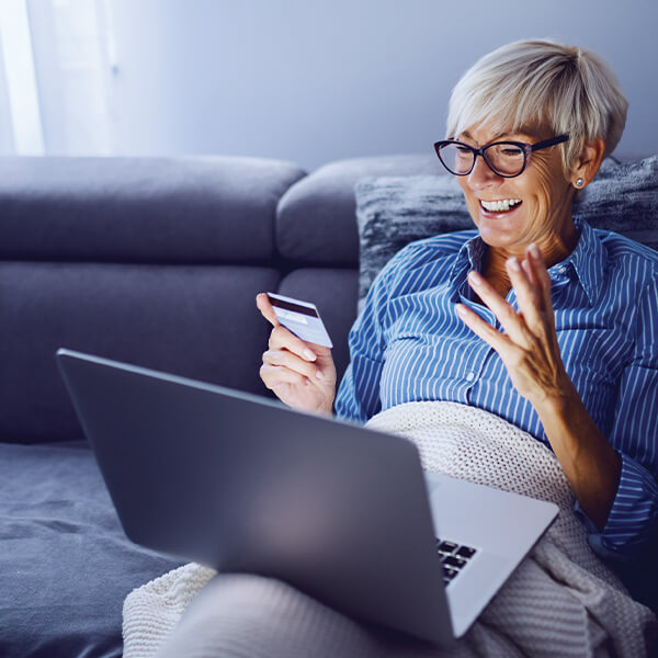 Woman with credit card and laptop