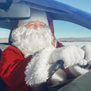 Santa Claus driving a car